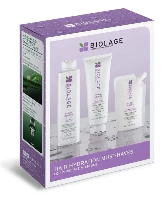 Biolage Hair Hydration Must-Haves gift set in a purple and white box, containing three white hair care products: a hydrating hair concentrate, a hydrating hair treatment, and a hydrating hair mask.