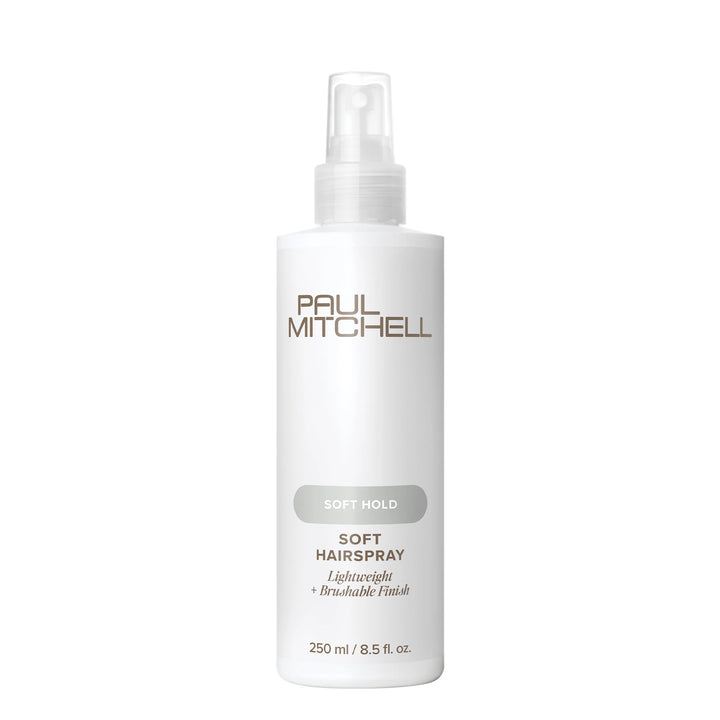 A white bottle of Paul Mitchell Soft Hairspray with a clear spray top, featuring gold and gray text on a clean white background.