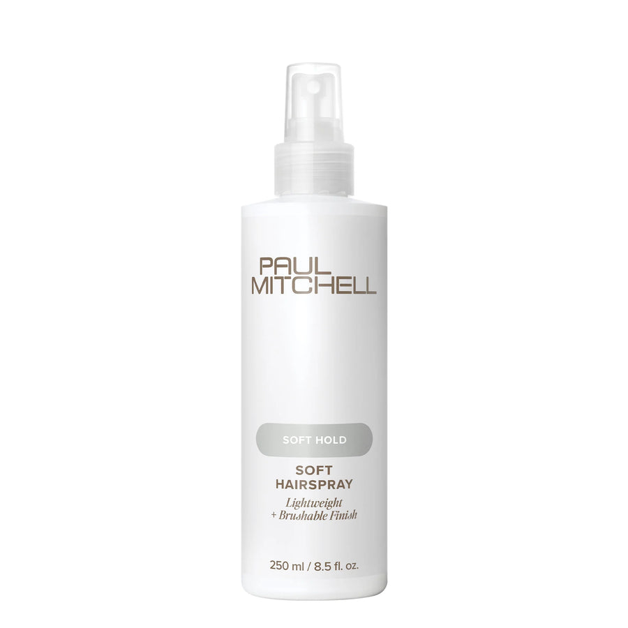 A white bottle of Paul Mitchell Soft Hairspray with a clear spray top, featuring gold and gray text on a clean white background.