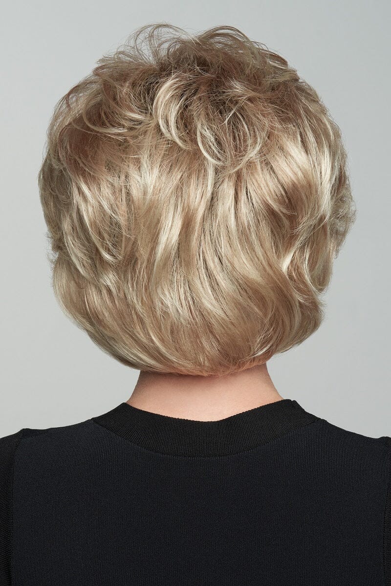 Blonde wavy bob haircut on a plain background