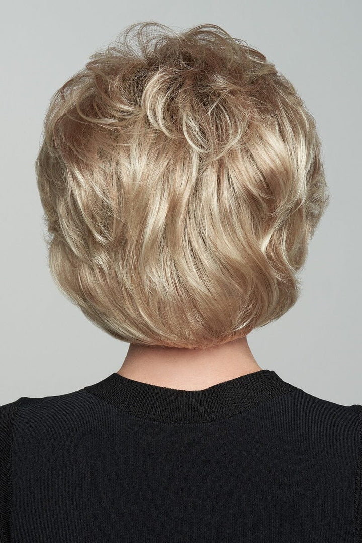 Blonde wavy bob haircut on a plain background