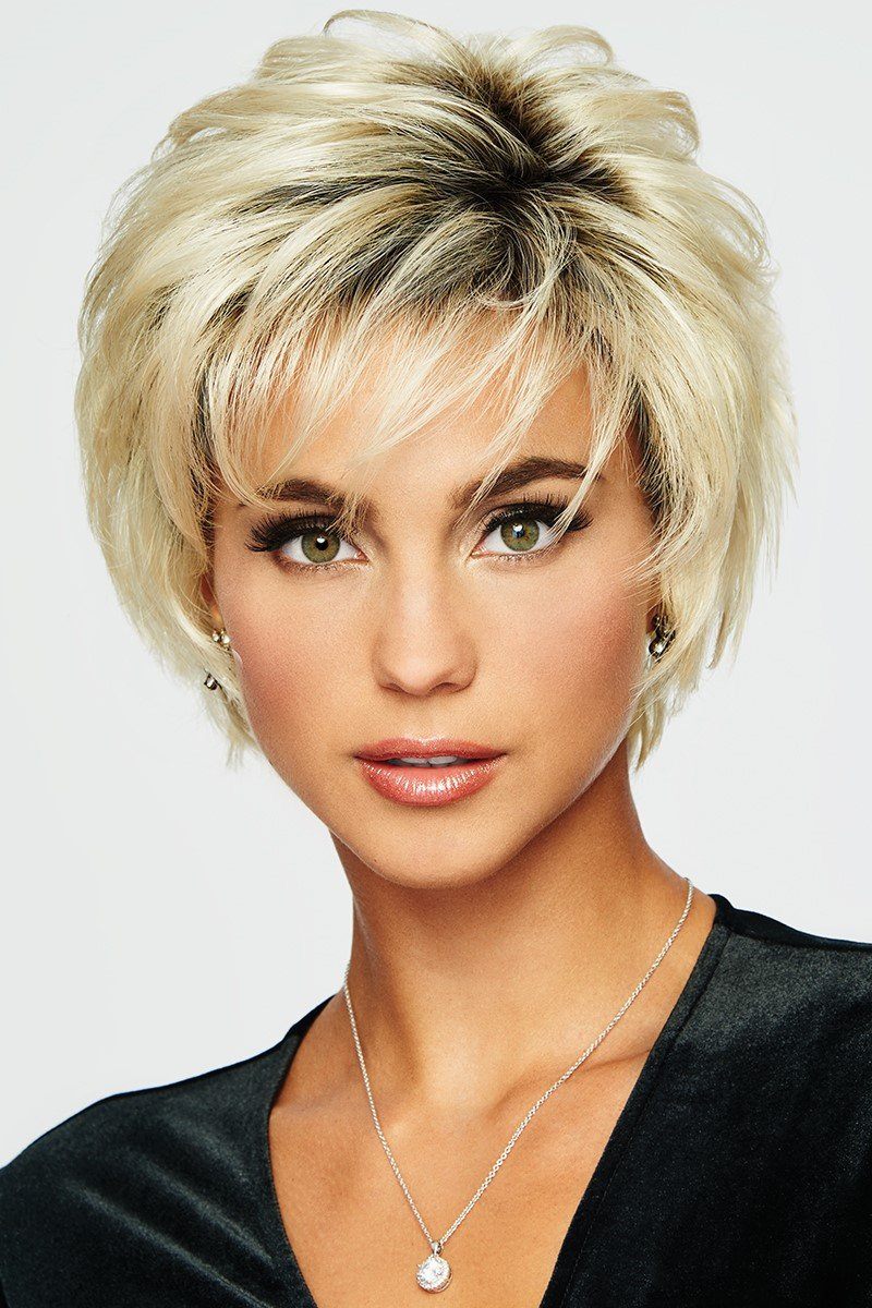 Woman with styled blonde hair against a white background
