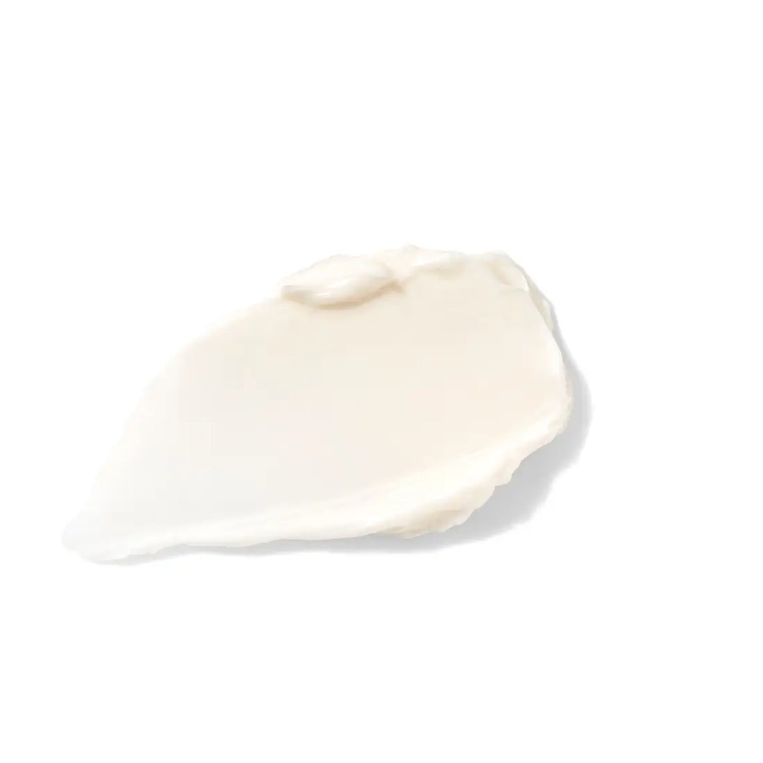 White cream swatch on a light beige background