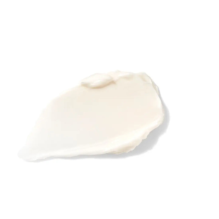 White cream swatch on a light beige background