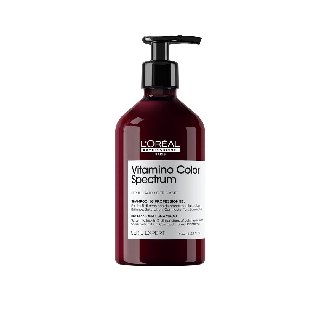 L'Oréal Professionnel Paris Vitamino Color Spectrum Professional Shampoo in a dark red translucent bottle with a black pump dispenser and white label, on a plain white background.