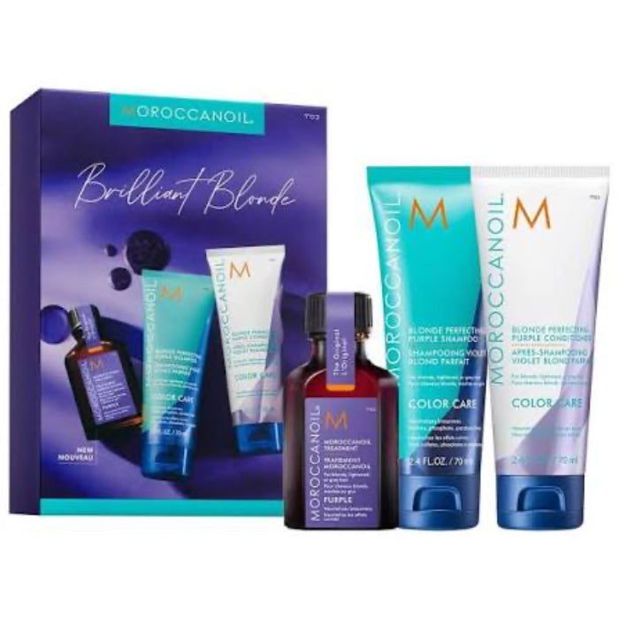 Moroccanoil Brilliant Blonde Color Care gift set featuring a purple and teal box alongside three product containers: a purple bottle, a turquoise shampoo tube, and a lavender conditioner tube.