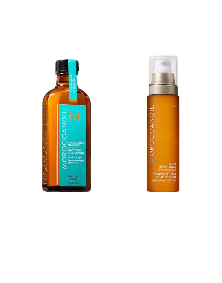 Two bottles of Moroccanoil hair care products on a light background