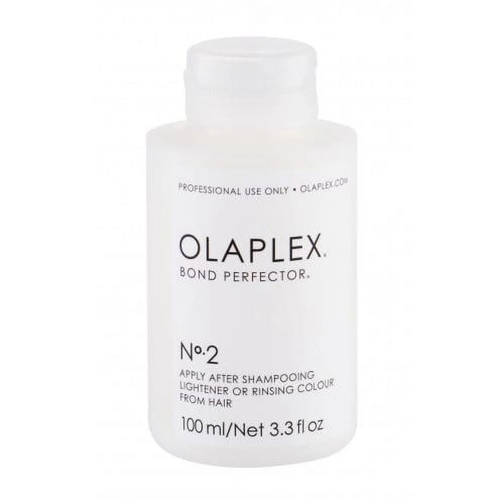 A bottle of Olaplex No 2 Bond Perfector hair treatment product.