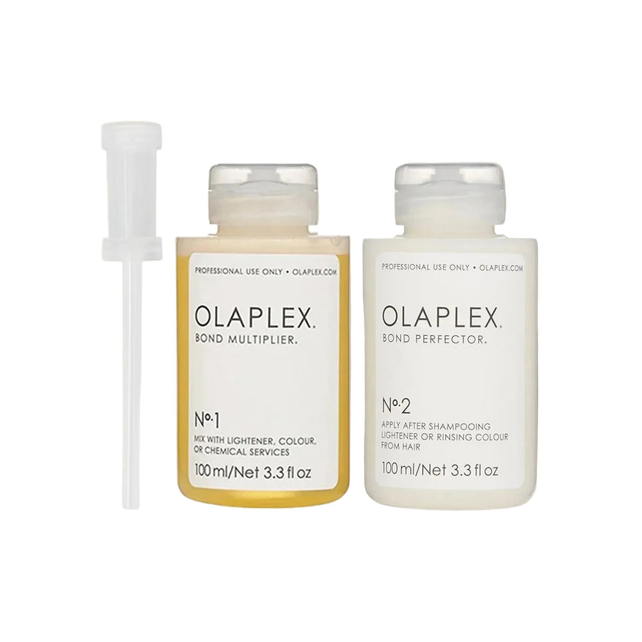 Two Olaplex hair care products on a beige shelf with a neutral background