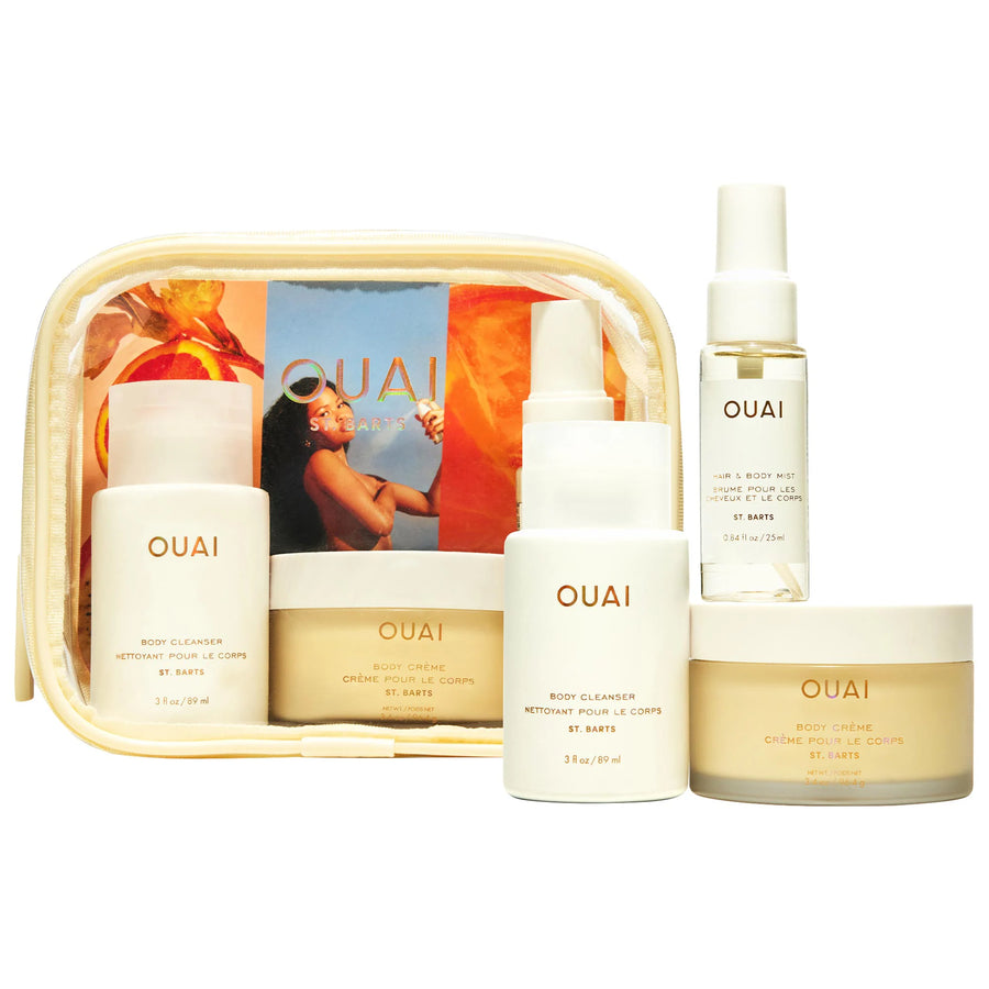 OUAI beauty product set including bottles and a pouch on a white background