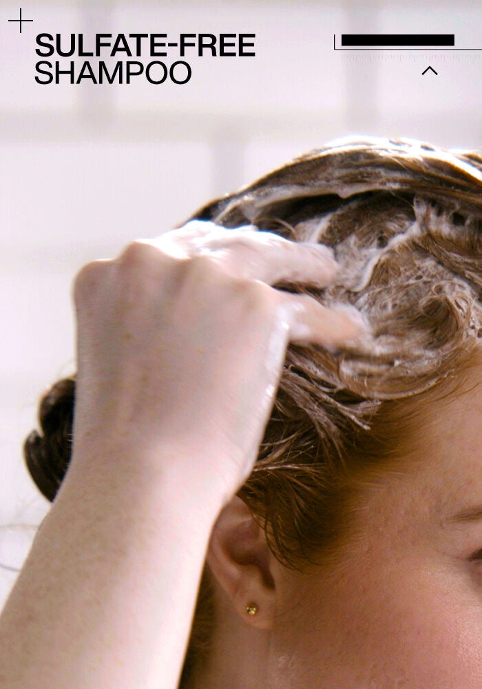 Redken Acidic Color Gloss Sulfate Free Shampoo image of model shampooing hair