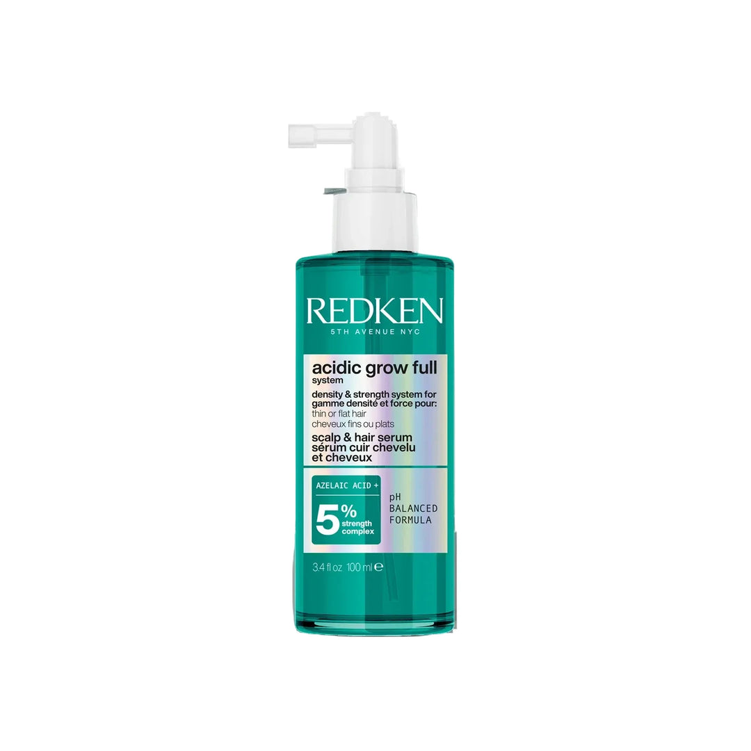 Redken bottle with pump on a white background