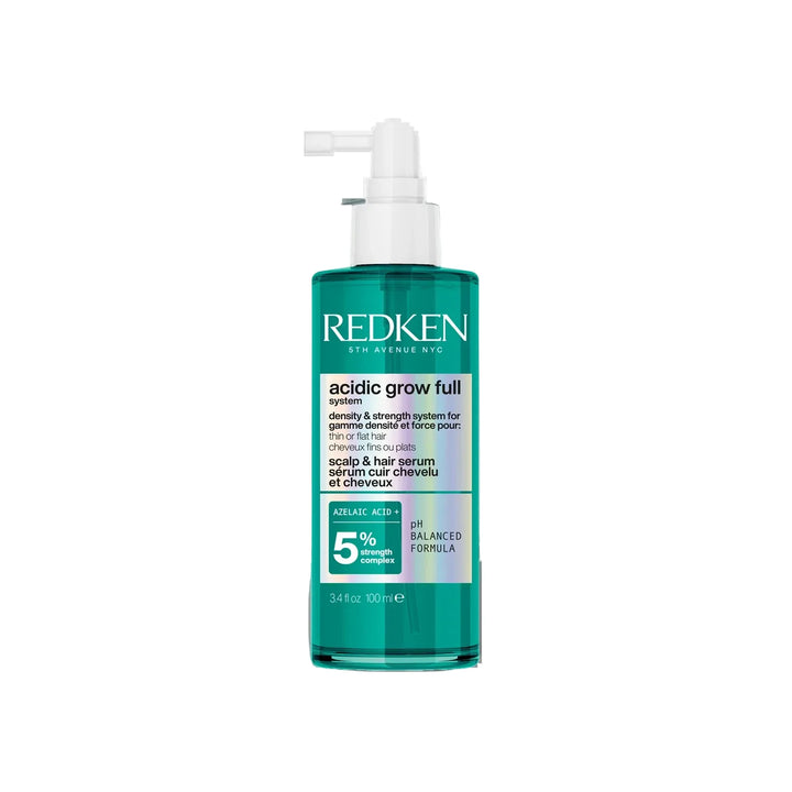 Redken bottle with pump on a white background