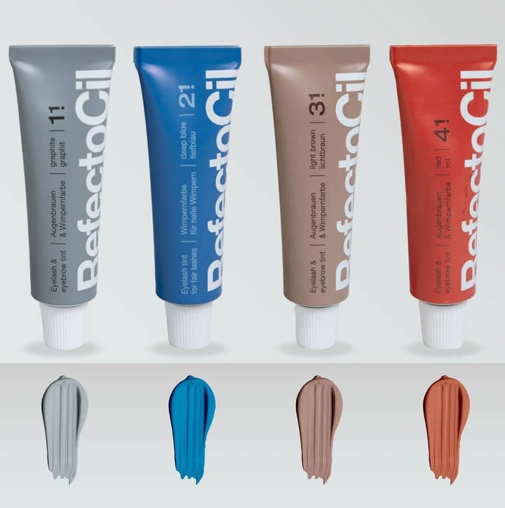 Four DefectoColor tubes in gray, blue, brown, and red with color swatches below on a white background.