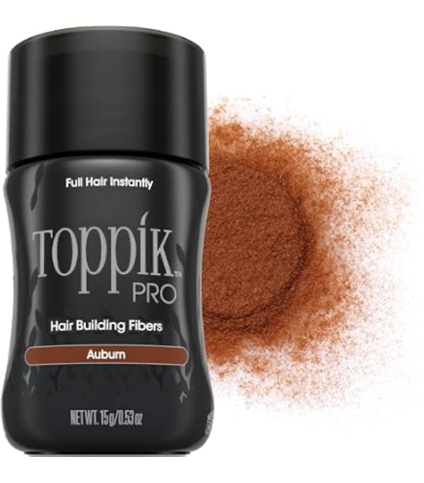 A black bottle of Toppik Pro Hair Building Fibers in Auburn scent, shown next to a textured pile of the brown powder itself on a white background.